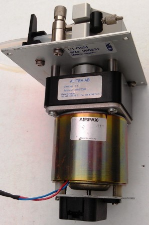 Motor with attached optical encoder and pump head